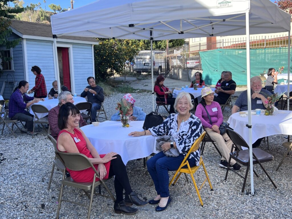 Tables set up at the open house. Seated at front table are Board Member Linda Bentz and Sue Fawn Chung